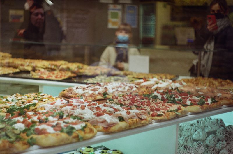 Inside Mod Pizza restaurant — fresh mod pizza ingredients on display